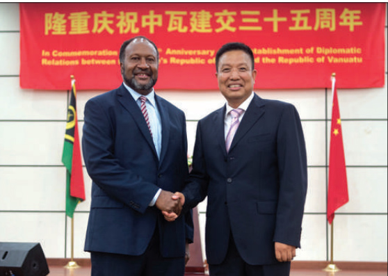 Vanuatu PM Charlot Salwai handshakes with Chinese President Xi Jinping