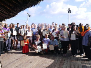 One hundred new citizens receive their citizenship certificate